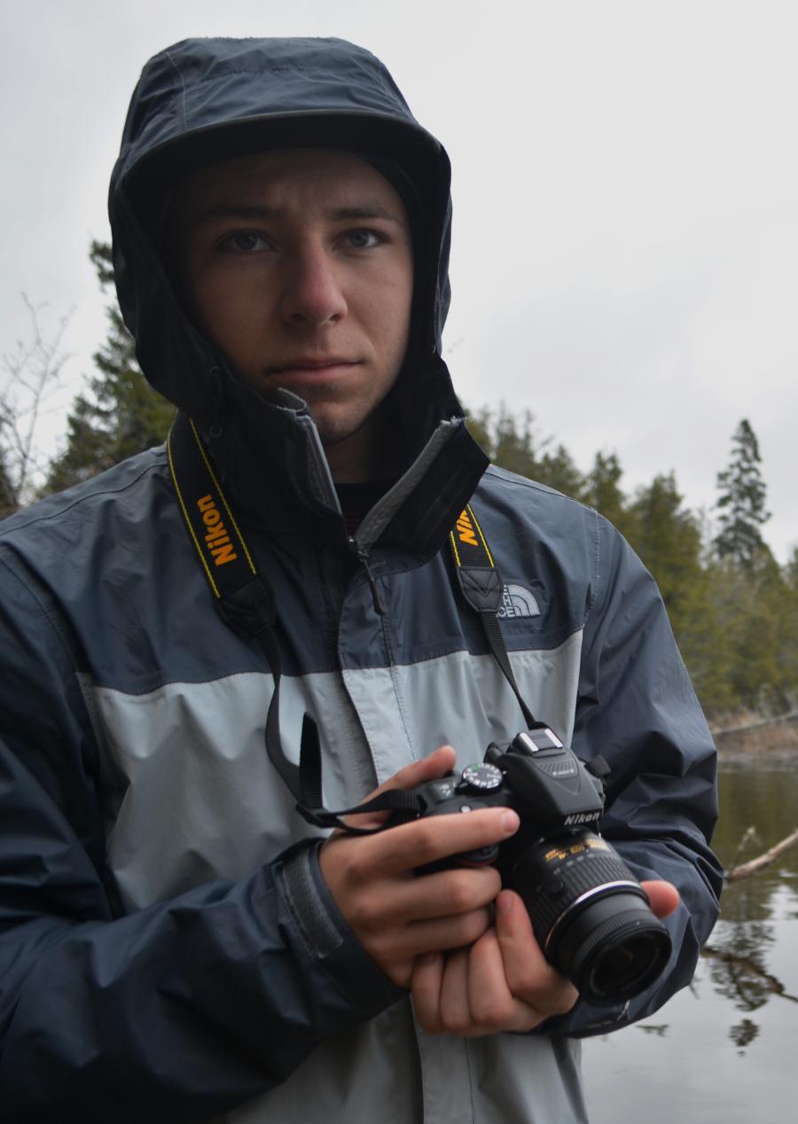 photo of Andrew holding a camera